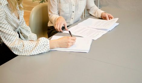 Professionals reviewing grant management documents