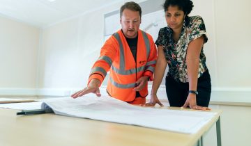 Professionals discussing risk assessment and safety management