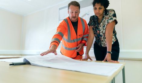 Professionals discussing risk assessment and safety management